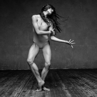 beautiful dancer posing on a studio background